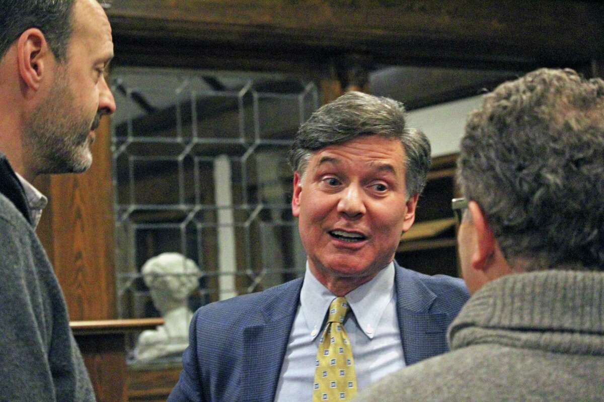 Dan Esty, center, former commissioner of the state Department of Energy and Environmental Protection, meets with members of the Aspetuck Land Trust Wednesday before delivering a talk on
