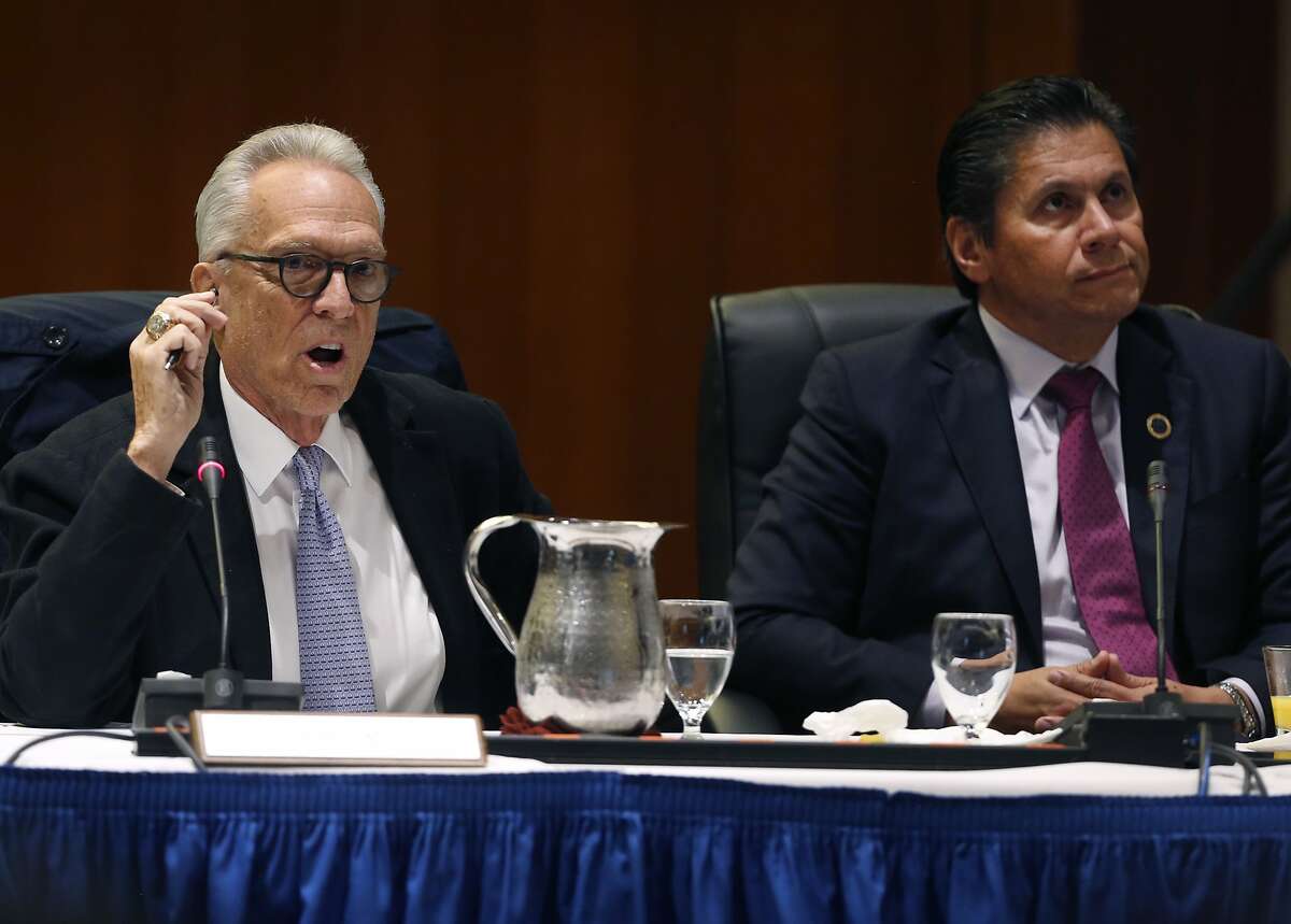 Regent Norman Pattiz (left) speaks during a meeting of the UC Board of Regents while Eloy Ortiz Oakley listens at the UCSF Mission Bay campus in San Francisco, Calif. on Thursday, Nov. 16, 2017.