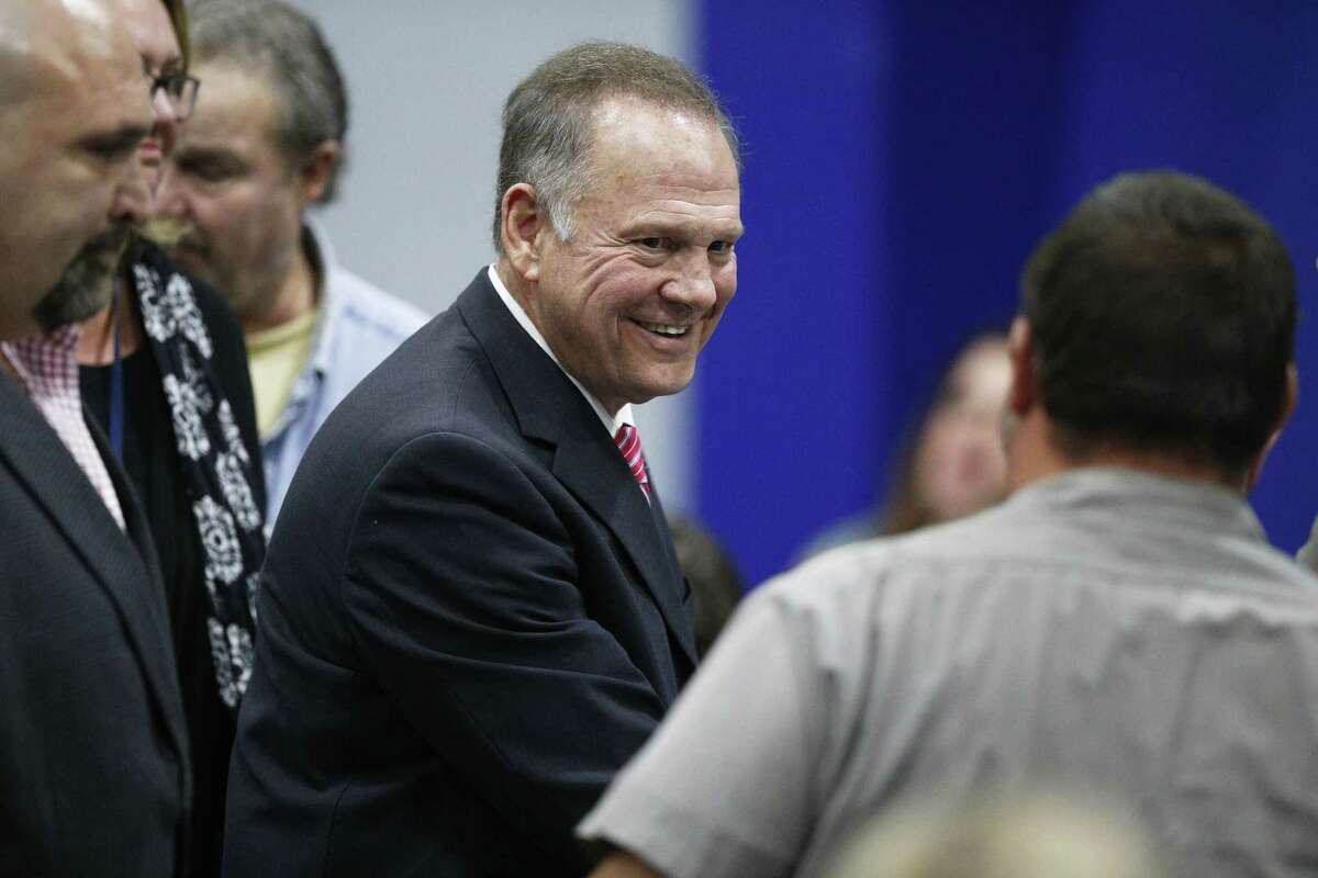 Former Alabama Chief Justice and U.S. Senate candidate Roy Moore walks out after he speaks at a revival, Tuesday, Nov. 14, 2017, in Jackson, Ala. (AP Photo/Brynn Anderson)