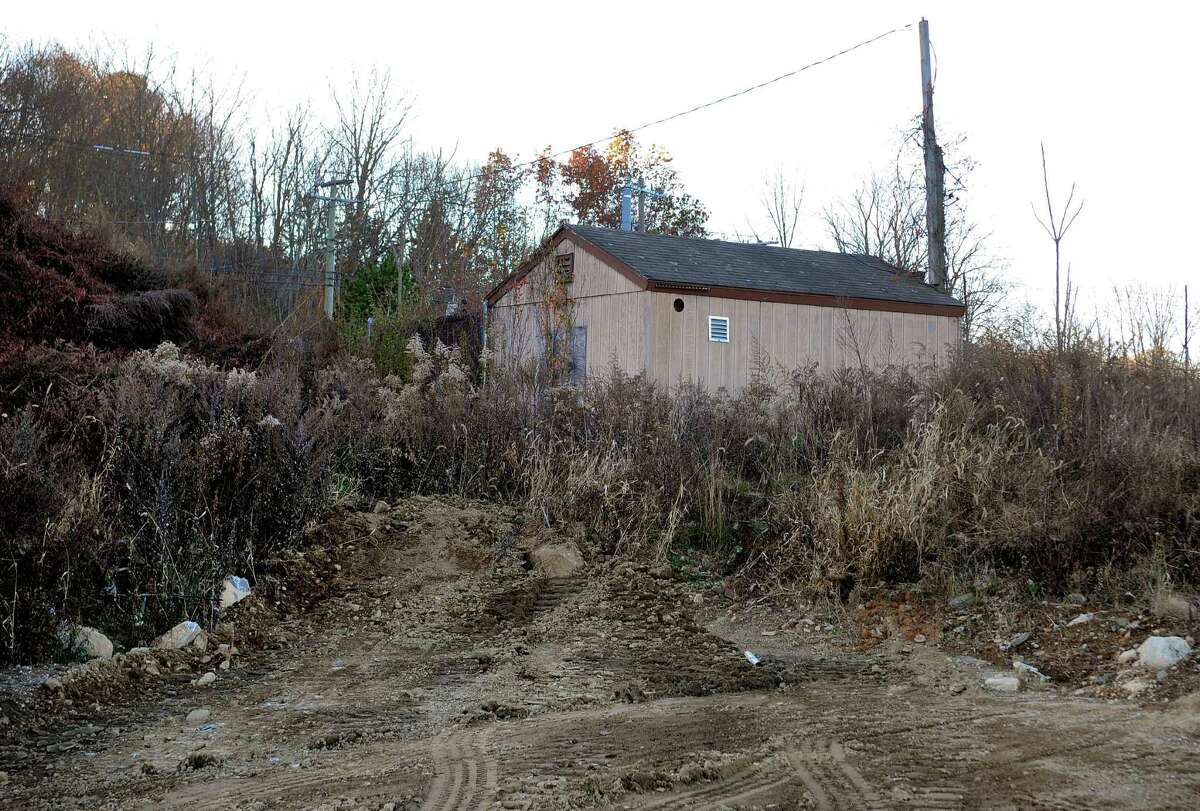 A lone building remains standing on a section of cleared land off of Victoria Drive in Monroe, Conn., on Friday Nov. 17, 2017. John Kimball of Monroe-based developer Kimball Landing Holdings, LLC released a statement today saying that Walmart officials informed his office that it has decided to no longer pursue building a Walmart Supercenter store on the site.