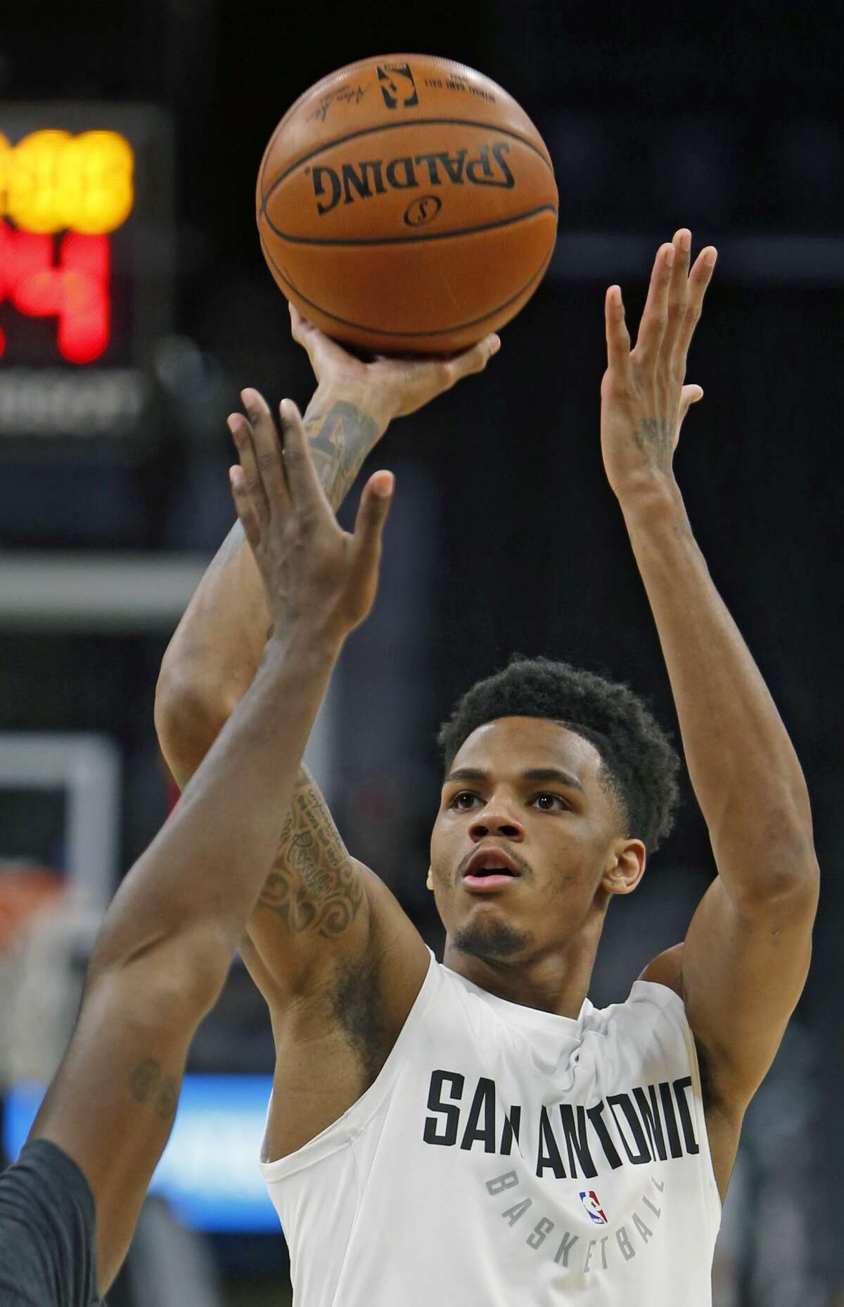 SAN ANTONIO, TX - NOVEMBER 17 : Dejounte Murray #5 of the San Antonio Spurs takes practice shots before the start of their game against the Oklahoma City Thunder at AT&T Center on November 17, 2017 in San Antonio, Texas. NOTE TO USER: User expressly acknowledges and agrees that , by downloading and or using this photograph, User is consenting to the terms and conditions of the Getty Images License Agreement. (Photo by Ronald Cortes/Getty Images)