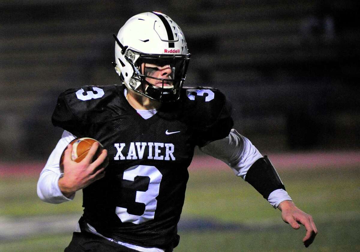Xavier QB Will Levis carries the ball during football action against Greenwich in West Haven, Conn., on Thursday Nov. 15, 2017.