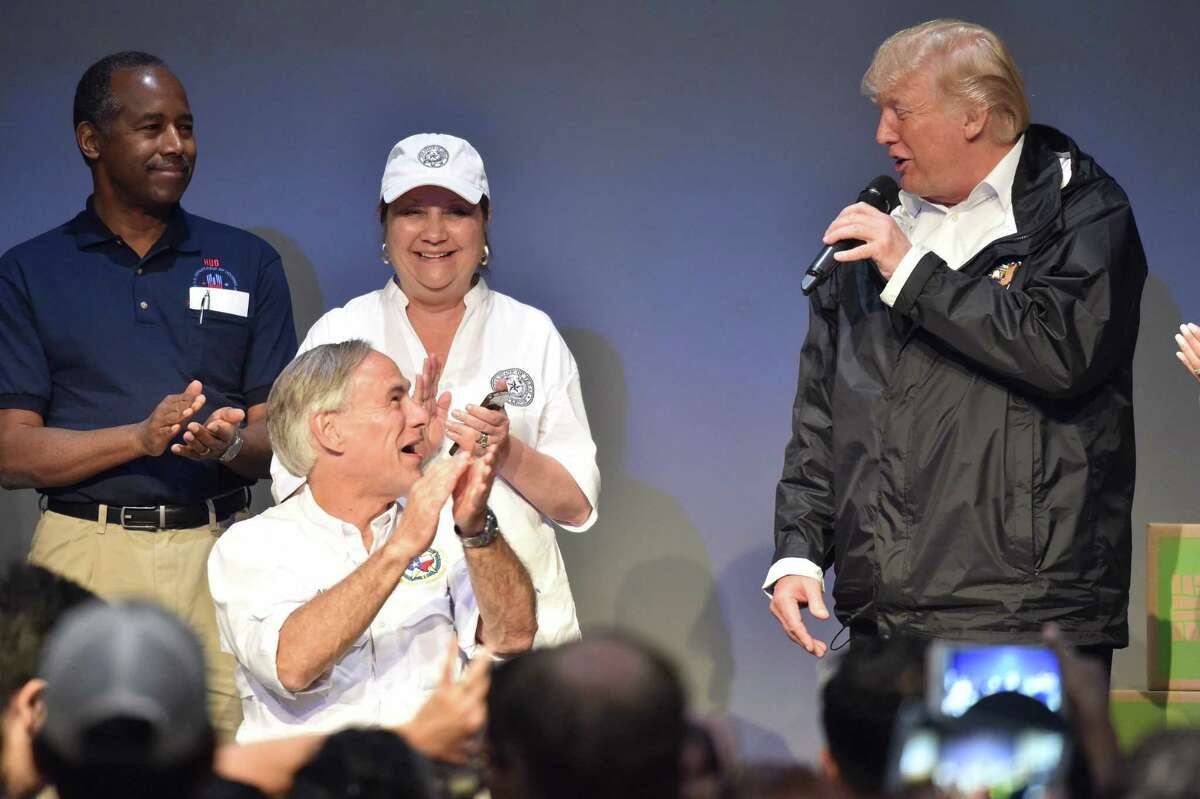 President Donald Trump speaks to volunteers at the First Church of Pearland during a Sept. 2 visit to areas affected by Hurricane Harvey. With Trump areSecretary of Housing and Urban Development Ben Carson and Texas Gov. Greg Abbott.