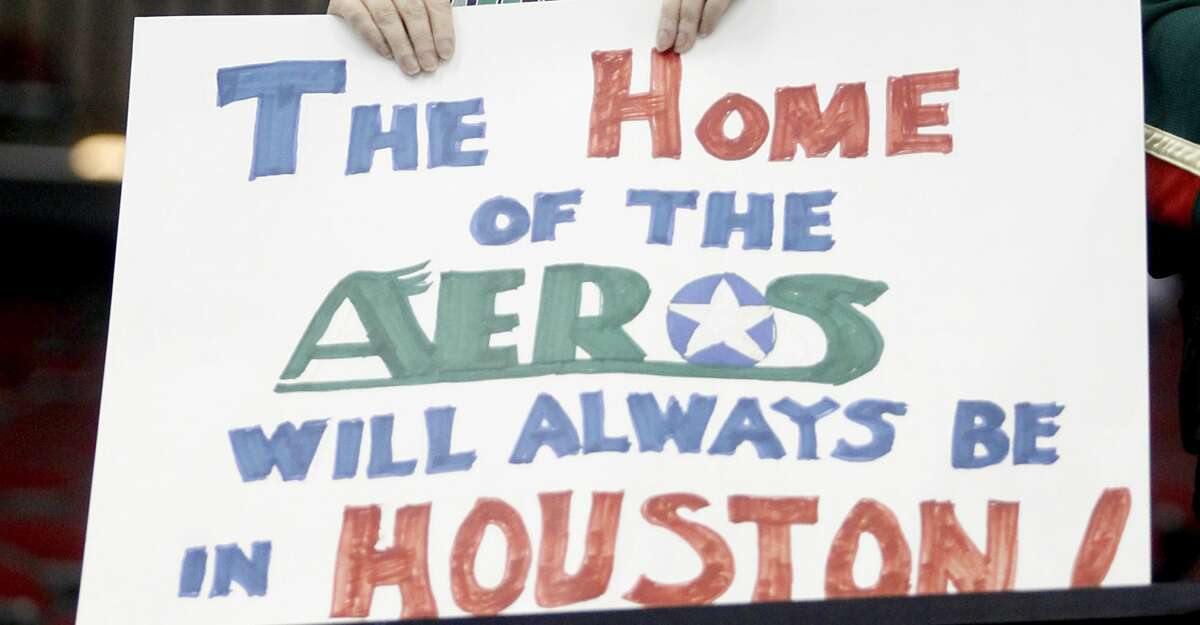 4/28/13: Candy Grasty holds a sign during the Houston Aeros against the Grand Rapids Griffins in the first period in game two of the Western Conference Finals at Toyota Center in Houston, Texas.