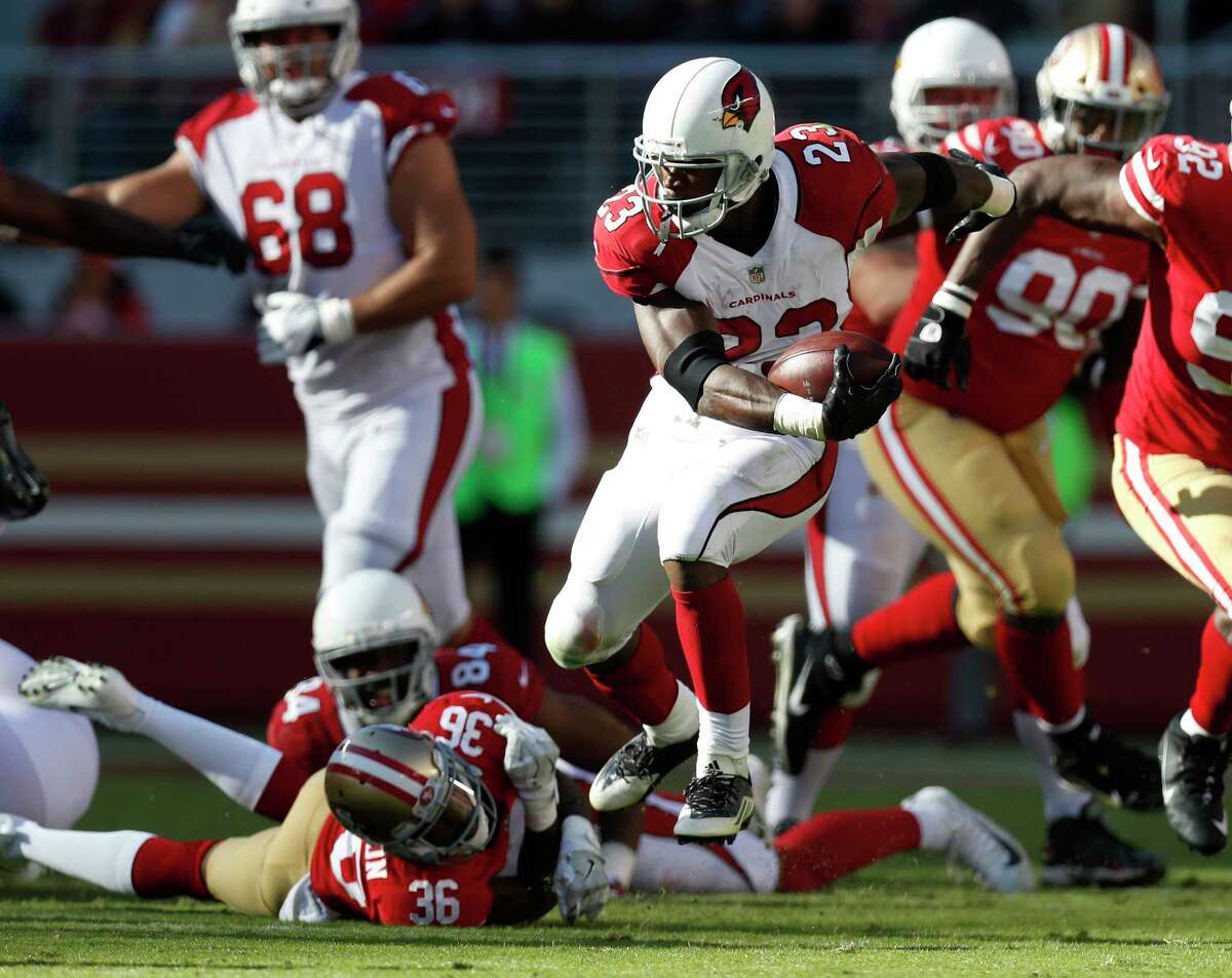 The Cardinals' Adrian Peterson, center, still has the moves and the energy as he proved by running for 159 yards on 37 carries against the 49ers on Nov. 5.﻿