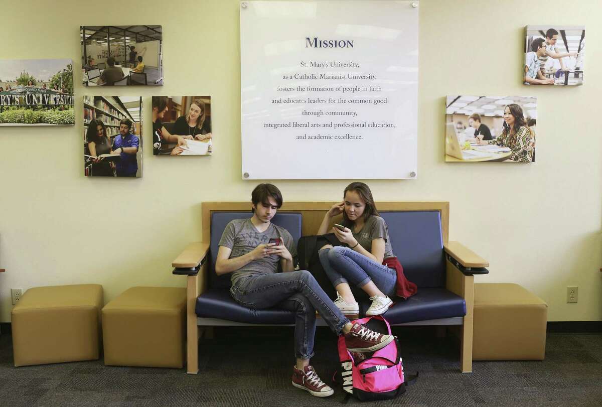 Alex Cantrell, 18, left, and Jade Evenstad, 18, hang out in the Charles L. Cotrell Learning Commons at St. Mary's University, Thursday, Nov. 16, 2017. Both are biology majors at the university.