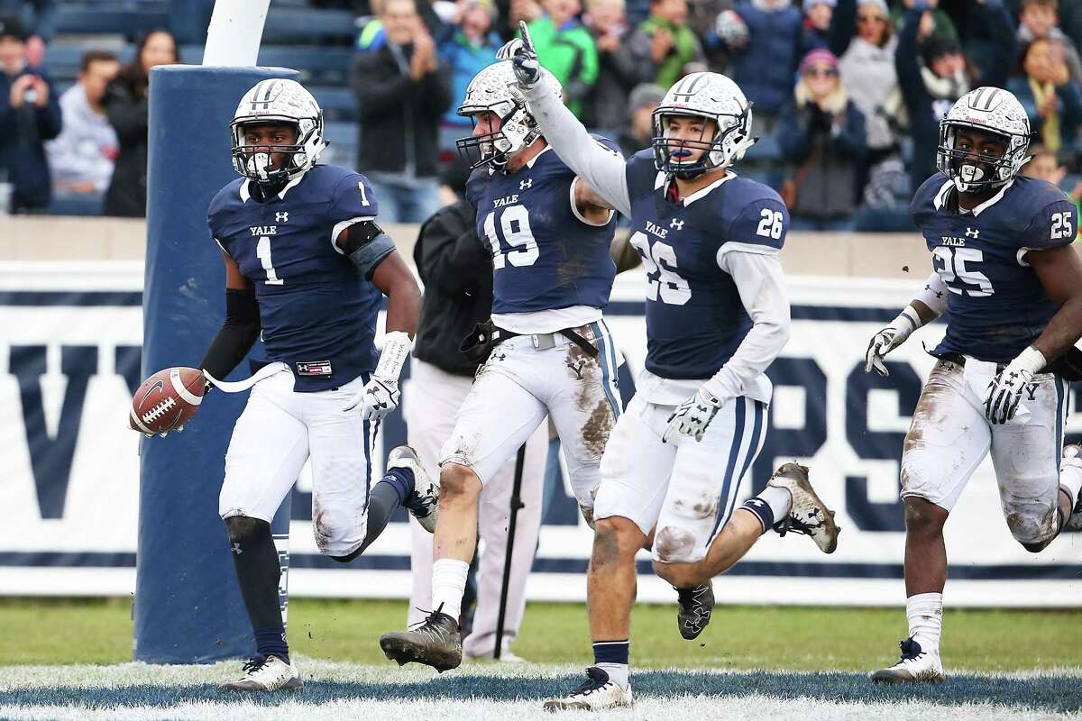 Yale’s Malcolm Dixon (1) reacts after scoring a touchdown in the first half against Harvard at Yale Bowl on Saturday.