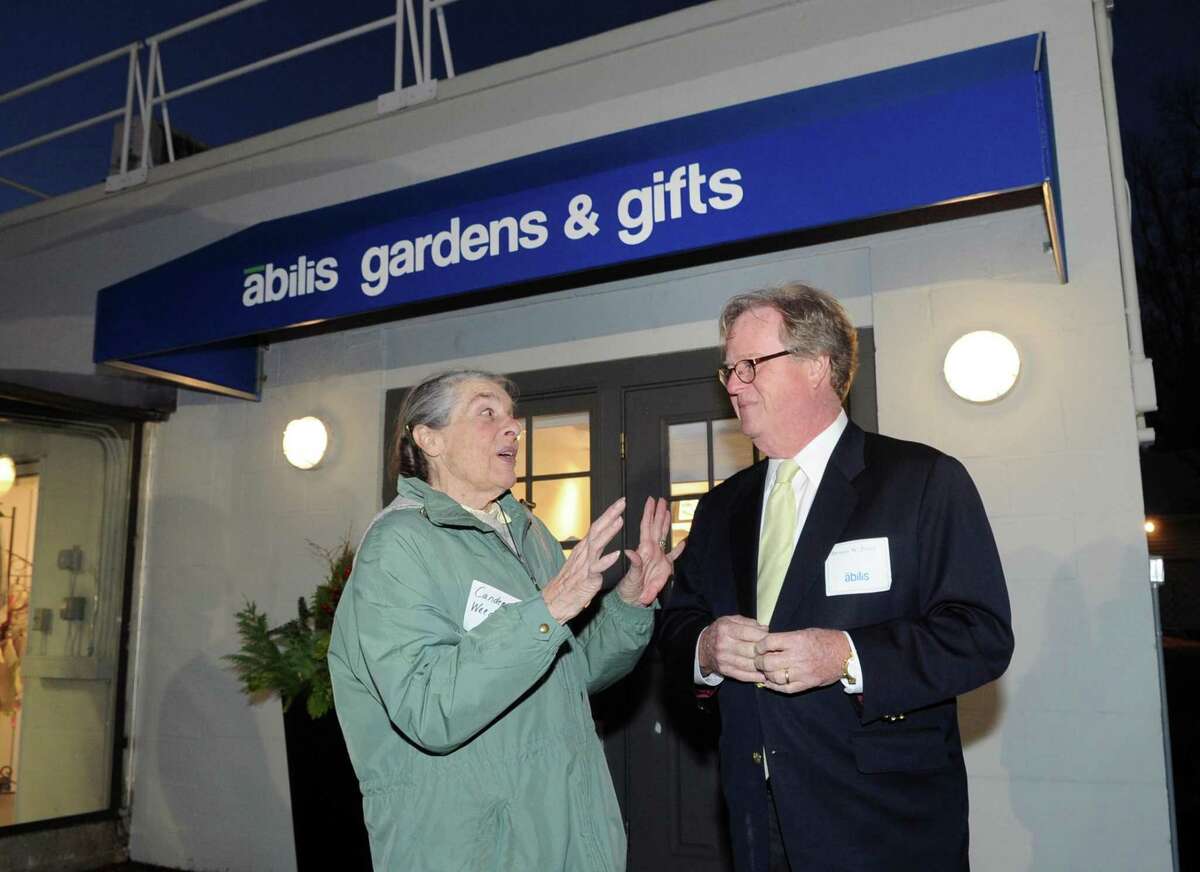 Candee Weed, left, speaks with Abilis President & CEO Dennis Perry during the grand re-opening and ribbon cutting ceremony for the newly remodeled Abilis Gardens & Gifts Shop at Abilis in the Glenville section of Greenwich, Conn., Thursday night, Nov. 16, 2017. The Abilis Gardens & Gift Shop is a retail training site where Abilis trains adults with developmental disabilities to work toward community-based jobs in the retail industry.