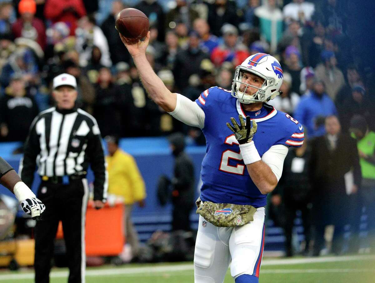 Buffalo Bills quarterback Nathan Peterman (2) runs before getting