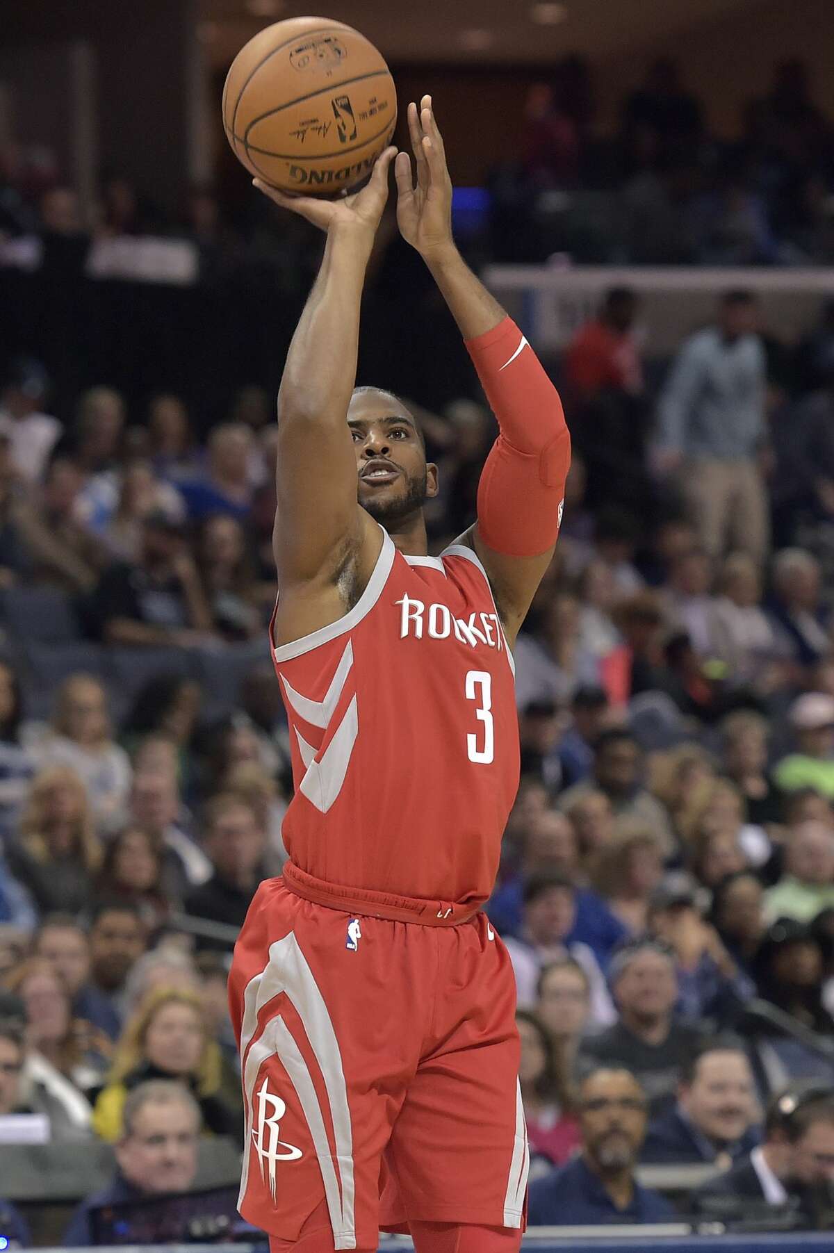 Houston Rockets guard Chris Paul (3) takes a 3-point shot during the first half of an NBA basketball game against the Memphis Grizzlies on Saturday, Nov. 18, 2017, in Memphis, Tenn. (AP Photo/Brandon Dill)