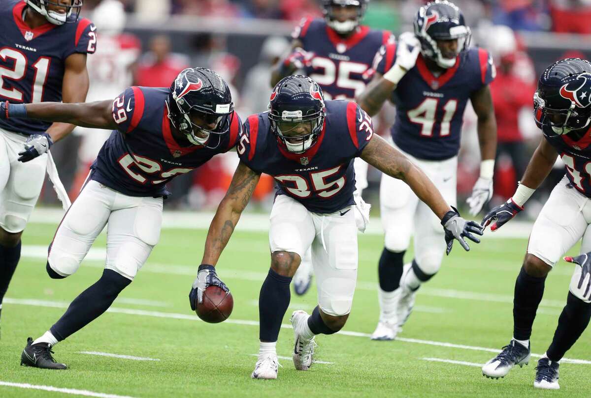Houston Texans defensive back Eddie Pleasant (35) celebrates with Andre Hal (29) after his interception of a pass intended for Arizona Cardinals wide receiver Brittan Golden (10) during the fourth quarter of an NFL football game at NRG Stadium, Sunday, Nov. 19, 2017, in Houston.
