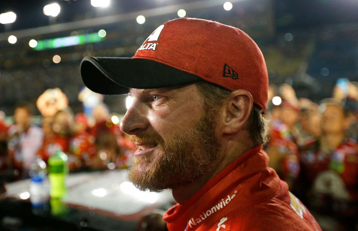 HOMESTEAD, FL - NOVEMBER 19: Dale Earnhardt Jr., driver of the #88 AXALTA Chevrolet, celebrates with teammates after his final cup series race, the Monster Energy NASCAR Cup Series Championship Ford EcoBoost 400 at Homestead-Miami Speedway on November 19, 2017 in Homestead, Florida. (Photo by Jonathan Ferrey/Getty Images)