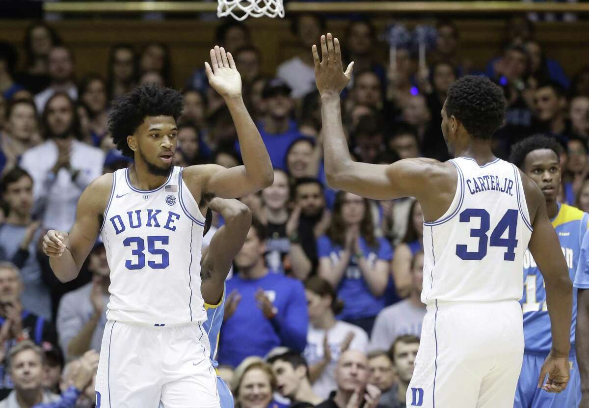 Duke's Marvin Bagley III, left, and Wendell Carter Jr. react following a play against Southern on Friday.