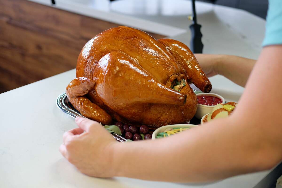Whisk Cake Creations designer Paula Nieto made a cake that looks just like a Thanksgiving turkey.