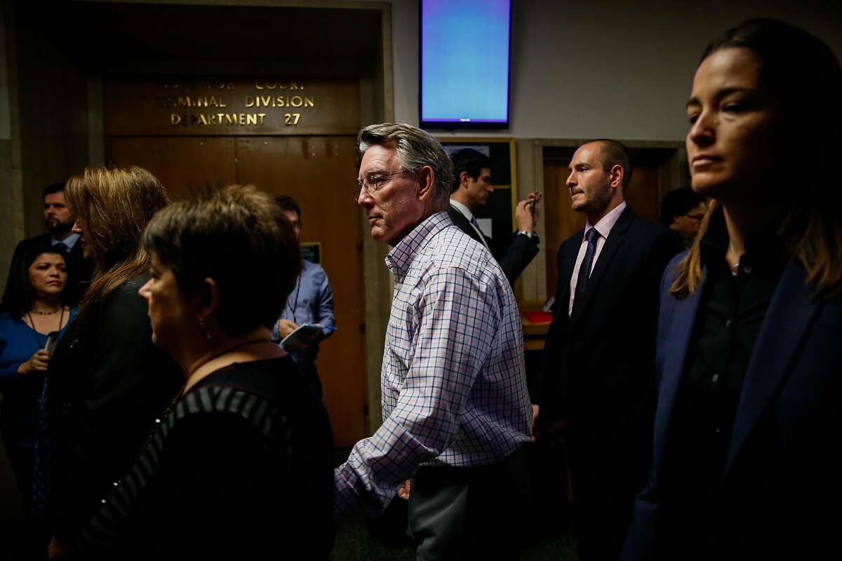 Jim Steinle (checked shirt, center), Kate Steinle's father and Liz Sullivan (black shirt,left), Kate Steinle's mother make their way through the Hall of Justice on the day of closing arguments in the Kate Steinle trial in San Francisco, Calif., on Monday, Nov. 20, 2017.