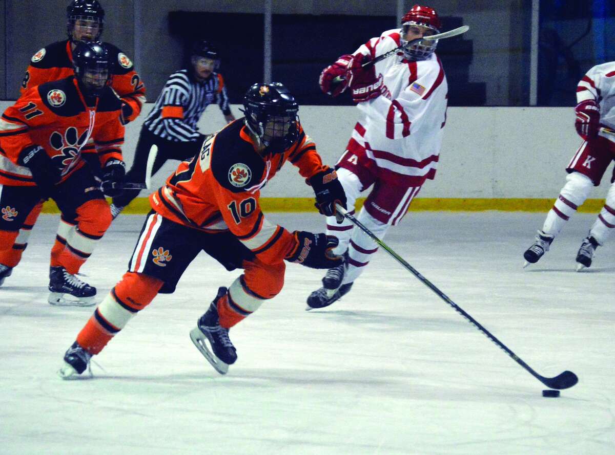 Edwardsville forward Mitchell Oberlag carries the puck out of his own zone during first-period action against Kirkwood on Monday in Queeny Park.