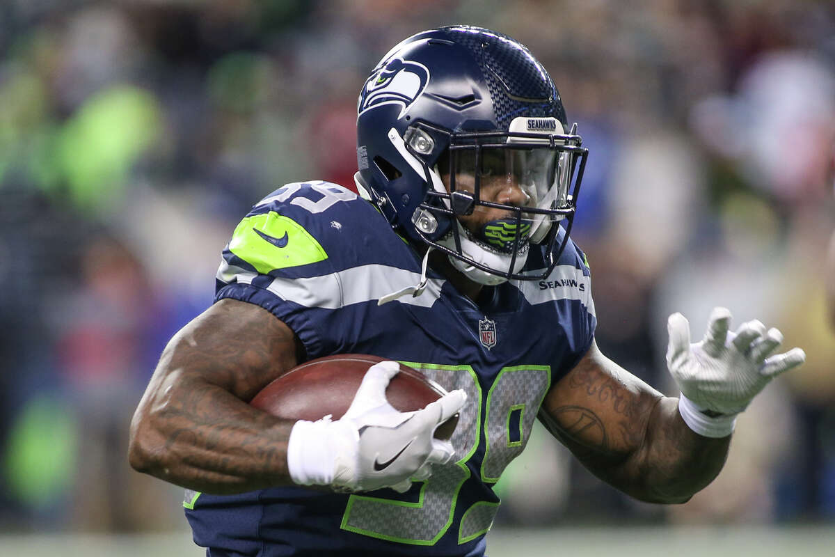 Seahawks running back Mike Davis runs the ball in the first half against the Atlanta Falcons at CenturyLink Field on Monday, Nov. 20, 2017.