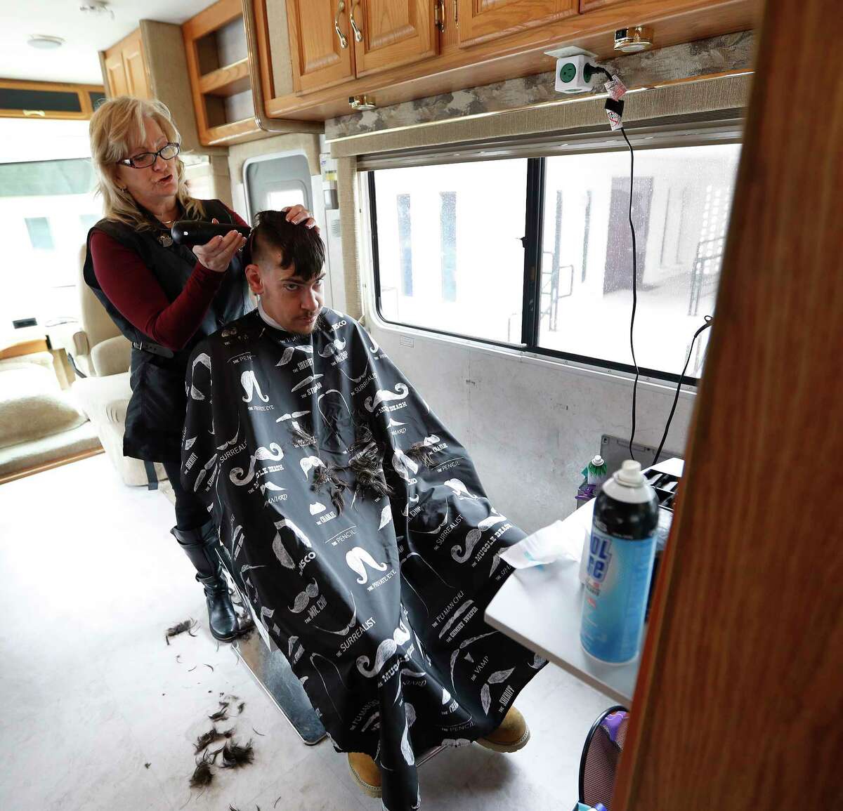 Barbara Goodson cuts Lawrence Campbell's hair in her mobile salon.﻿ Barbara Goodson cuts Lawrence Campbell's hair in her mobile salon.﻿
