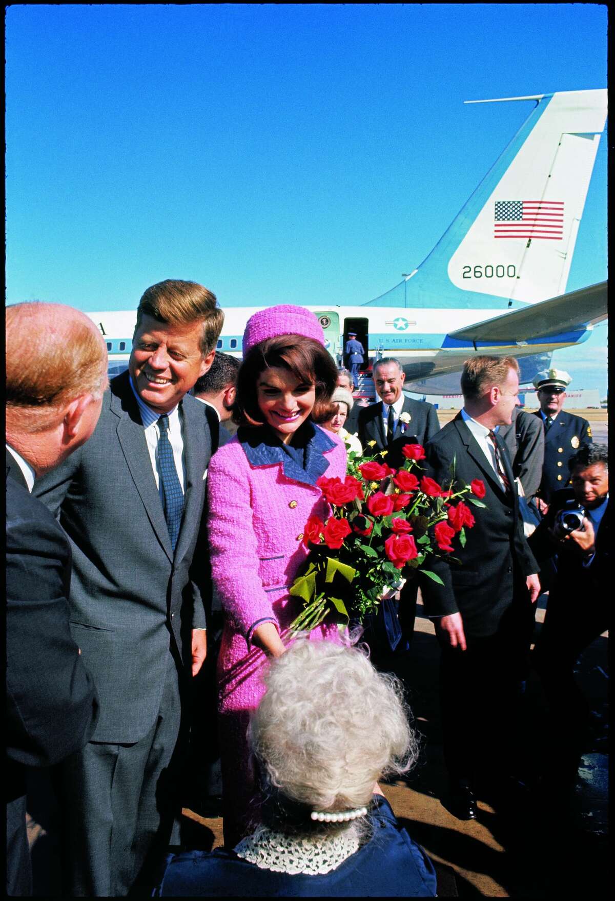 President John F. Kennedy and bouquet-carrying Jackie Kennedy arriving at Love Field, on the campaign tour with Vice President Lyndon and Lady Bird Johnson, November 22, 1963.