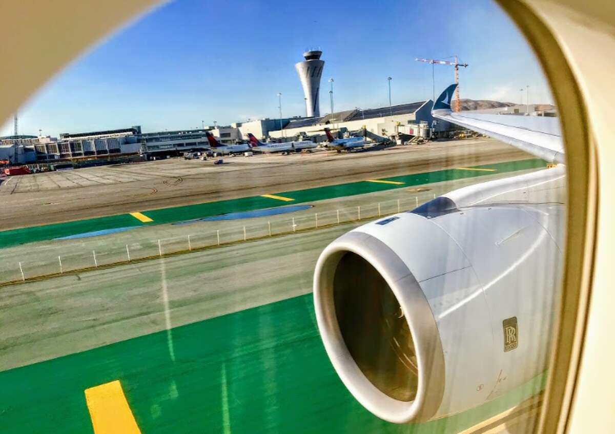 See the curledd wingtip of thie Cathay Pacific Airbus A350? (Chris McGinnis)