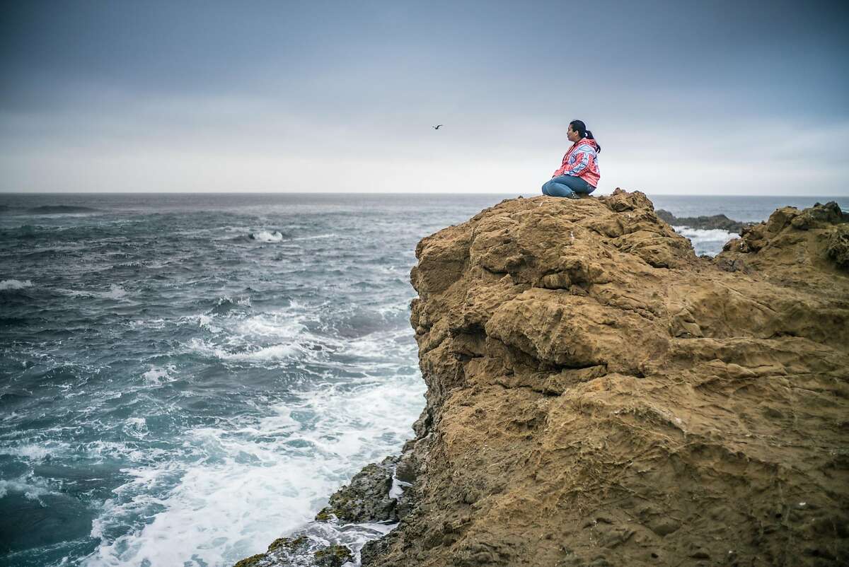 Hillary Renick sits at an ancestral Pomo tide pool at the Noyo Headlands in Calif. on Friday, Nov. 3, 2017. Renick is a member of Sherwood Pomo (Sherwood Rancheria).