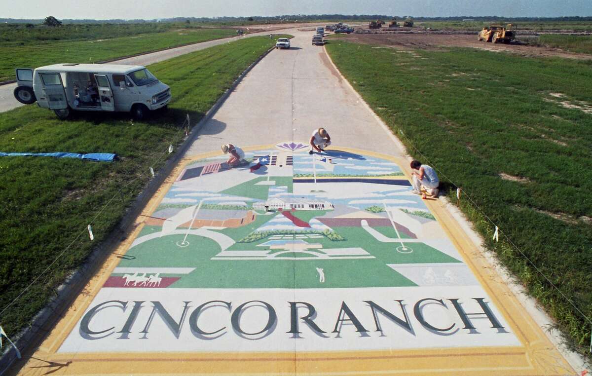 For an opening ceremony in 1986, Mason Road, which bisects Cinco Ranch, was decorated with a street mural depicting past and future uses of the historic property.