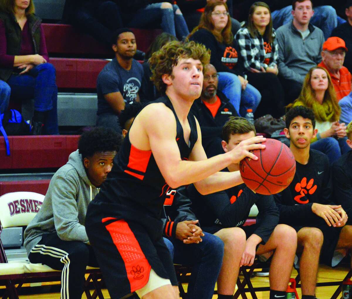 Edwardsville senior guard Jack Marinko lines up a 3-point attempt during the third quarter of Tuesday’s season-opening game at De Smet in St. Louis.