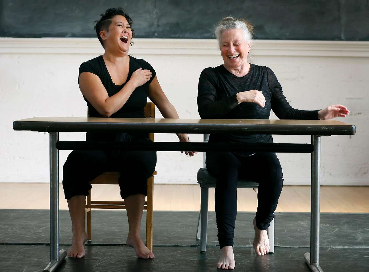 Sue Li Jue and Joan Lazarzus laugh during a rehearsal for Homeward, a dance performance choreographed by artistic director Sarah Bush, in Berkeley, Calif. on Tuesday, Nov. 21, 2017.