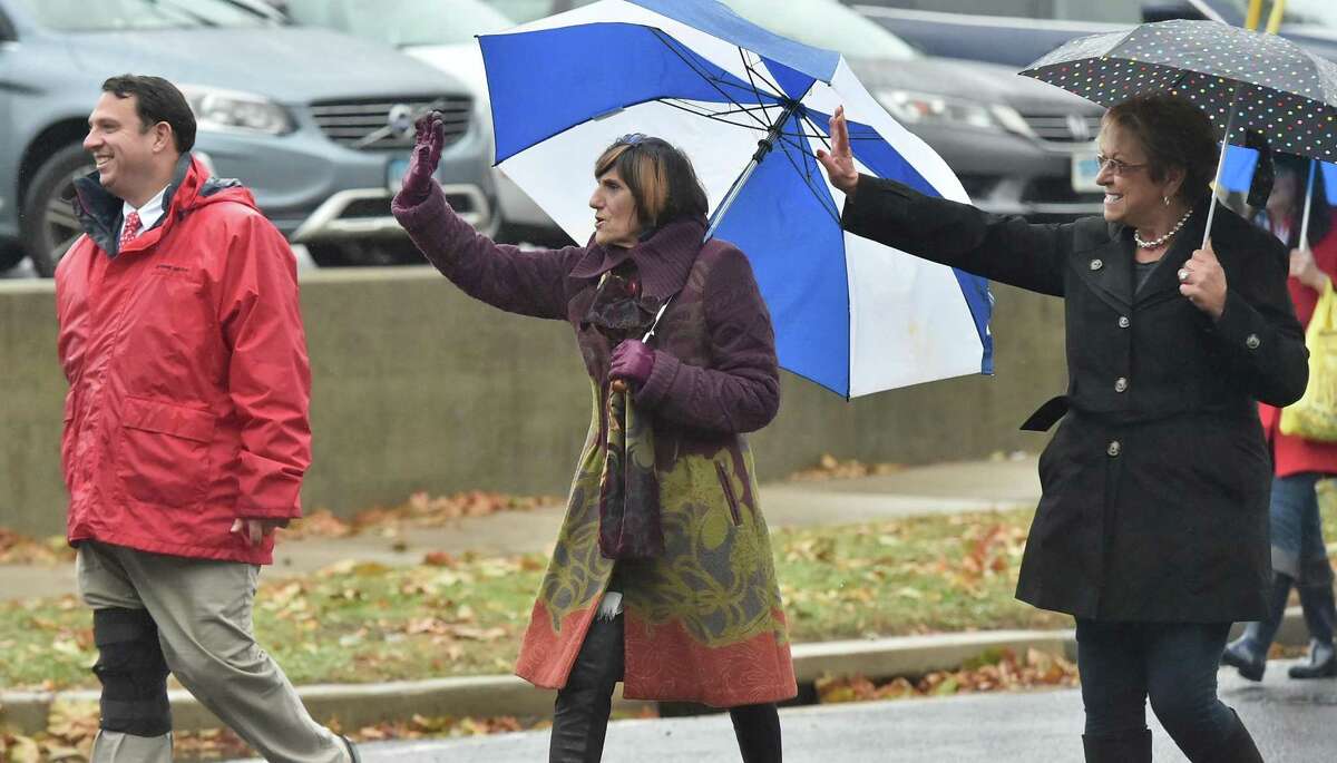 Milford Mayor Ben Blake and Rep. Rosa DeLauro, D-Conn. brave a rainy day to attend the Milford Veterans Day parade in Milford, Conn. on Sunday, November 5, 2017