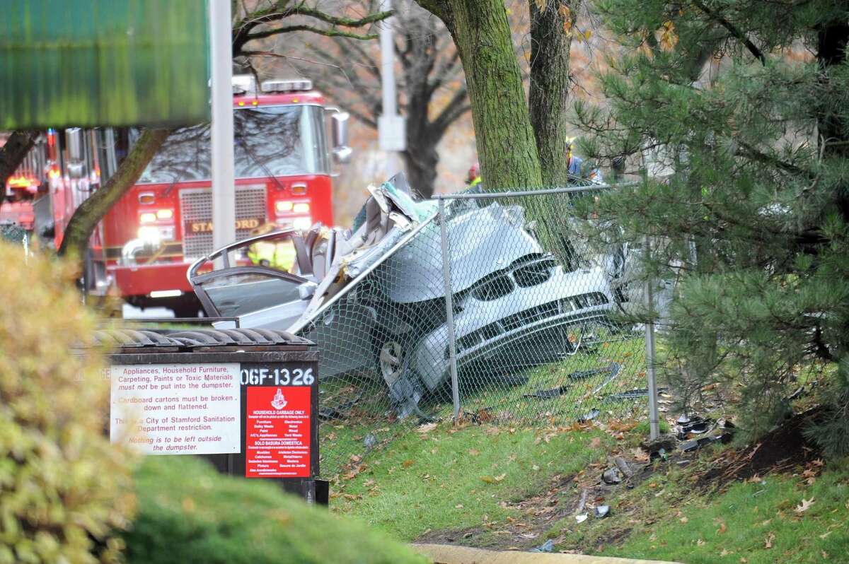 A silver BMW sits on the side of Washington Boulevard after being involved in a single car accident in downtown Stamford, Conn. on Wednesday, Nov. 22, 2017.