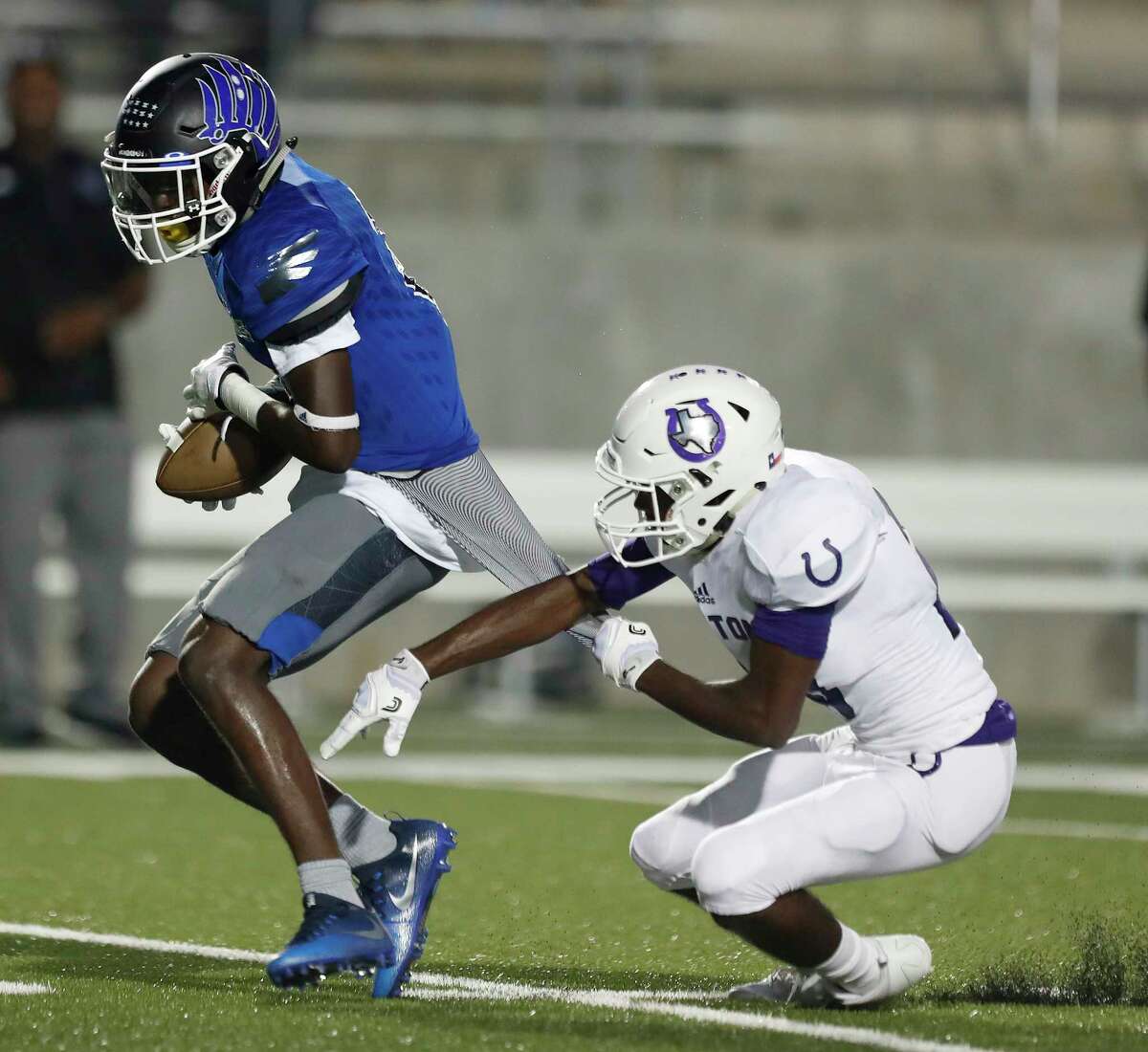 New Caney's Dwight McGlothern reaches up to catch a pass over Dayton's Treval Keener (20), which he ended up running in for a touchdown during the first half of a high school fiootball game at Texan Drive Stadium, Friday, Sept. 29, 2017, in Porter. ( Karen Warren / Houston Chronicle )