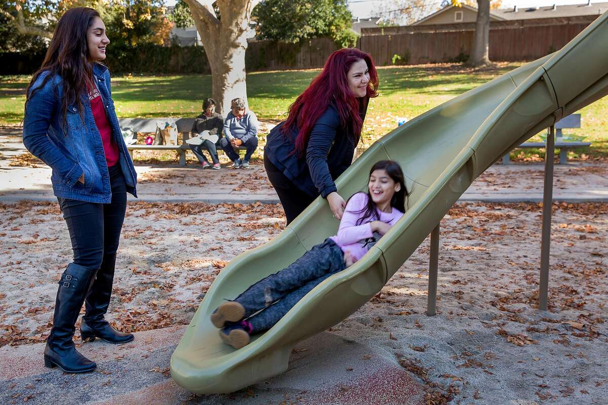 From left: Diana Nasseri with her mother Habiba and sister Iman, 9, at the park on Saturday, Nov. 18, 2017, in Santa Clara, Calif. Habiba participated in a study to share her genetic data with UCSF and Color Genomics.