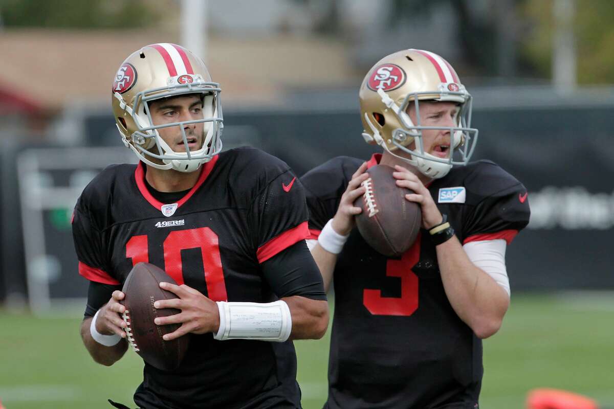 Jimmy Garoppolo (l to r), 49ers quarterback, and C.J. Beathard, 49ers quarterback practice with teammates at the Levi's Stadium practice field on Thursday, November 2, 2017 in Santa Clara, Calif.