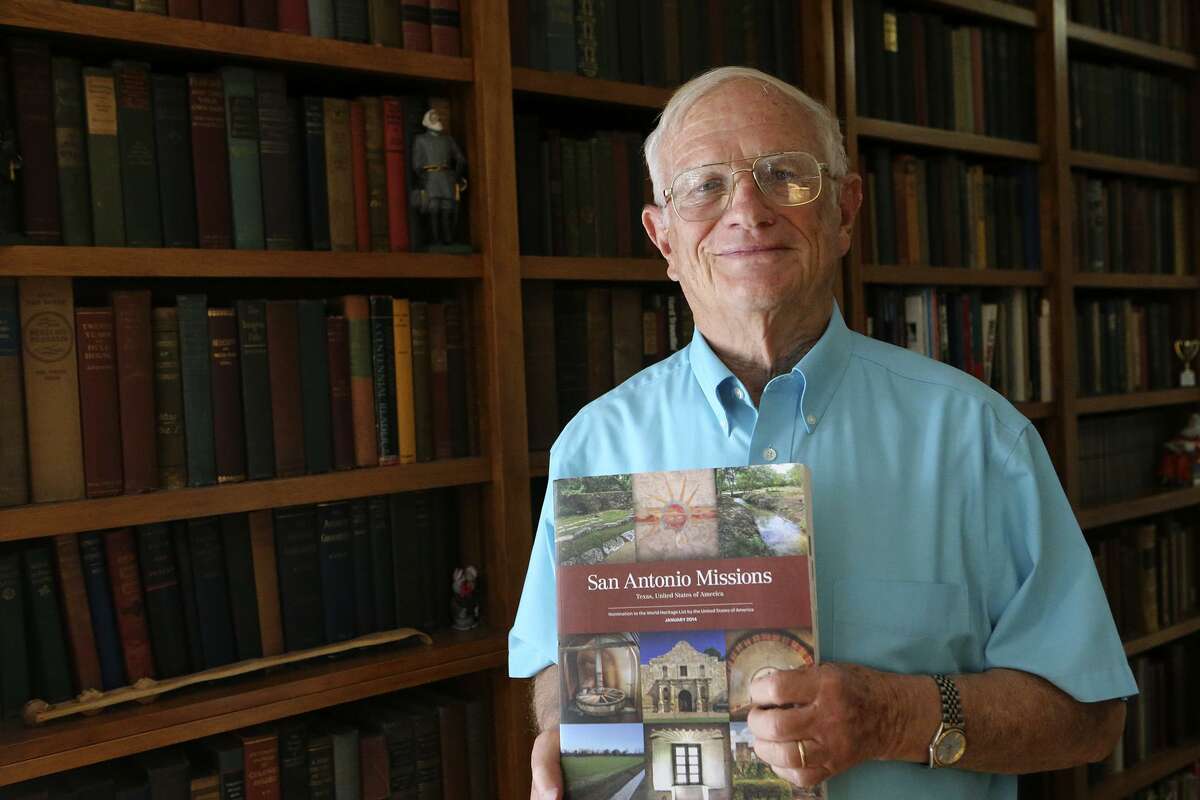 Paul Ringenbach stands by his home library Oct. 23 with his compilation of work on San Antonio's missions. Ringenbach is the lead author of the nomination document for the UNESCO World Heritage Inscription of the San Antonio Missions.