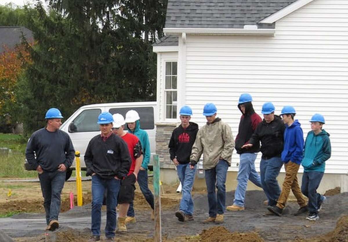 Averill Park High School construction technology students visited the Michaels Group housing development site, Newell Place in the town of Bethlehem on Oct. 26. The students were invited by Eric Willson and Luke Michaels, principals of the Michaels Group, to tour several homes under development and learn more about construction techniques as well as the various stages of construction. Willson is also president of the New York State Builders Association and member of the Capital Region Builders and Remodelers Association.