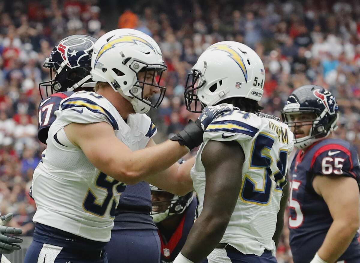 PHOTOS: Texans vs. Jaguars  HOUSTON, TX - NOVEMBER 27: Joey Bosa #99 of the San Diego Chargers celebrates with Melvin Ingram #54 after a sack against the Houston Texans at NRG Stadium on November 27, 2016 in Houston, Texas. (Photo by Tim Warner/Getty Images) >>>See more photos from the Texans' first win of the season ... 