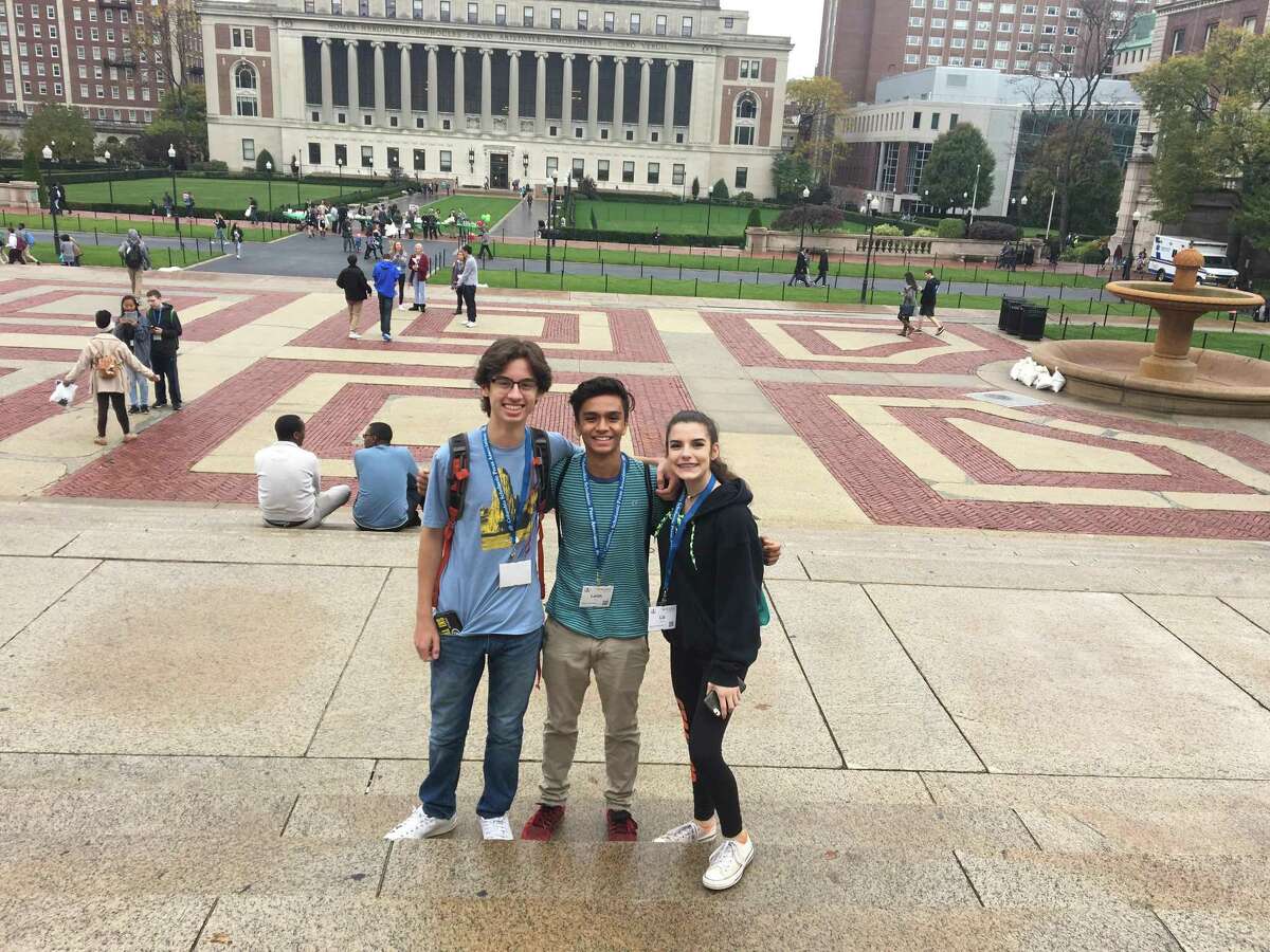 From left, Stamford High juniors Nathan Dancy, Lalith Goli and Elizabeth Santoro attend the 78th annual Columbia Scholastic Press Association Fall Conference.