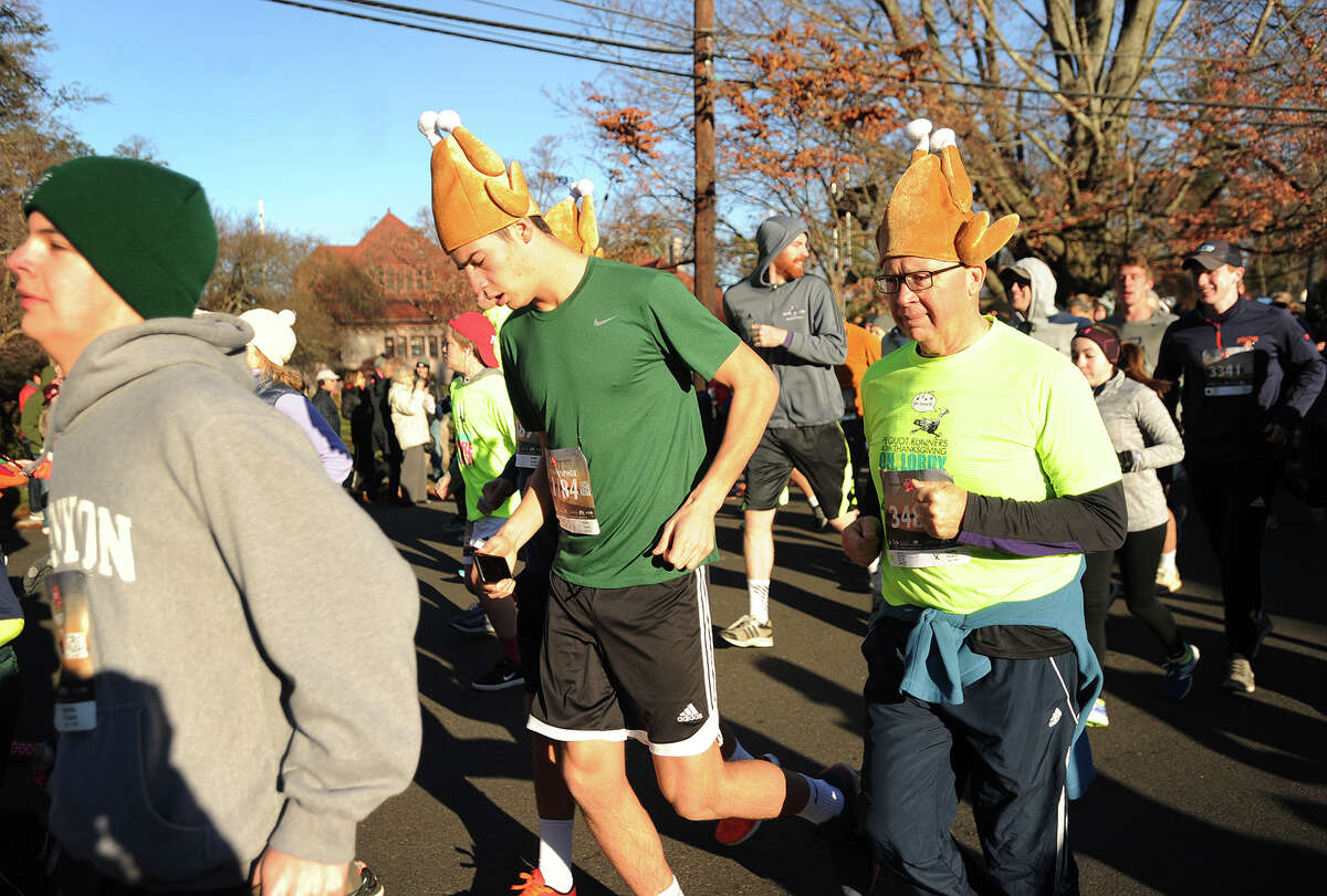 Many of the runners take to the Southport roads wearing festive headgear for the holiday during the annual Pequot Runners 5-mile Thanksgiving Day Road Race in Fairfield, Conn. on Thursday, November 23, 2017. Over 4000 runners registered for this year's race.