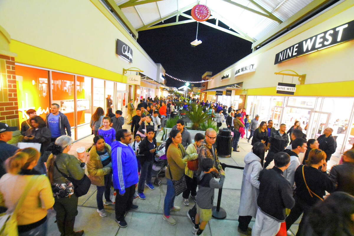Fewer shoppers swarm stores this Black Friday morning
