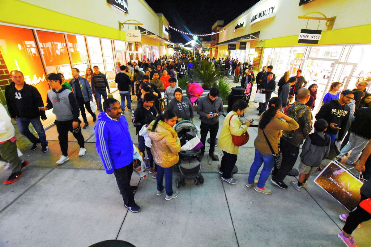Fewer shoppers swarm stores this Black Friday morning