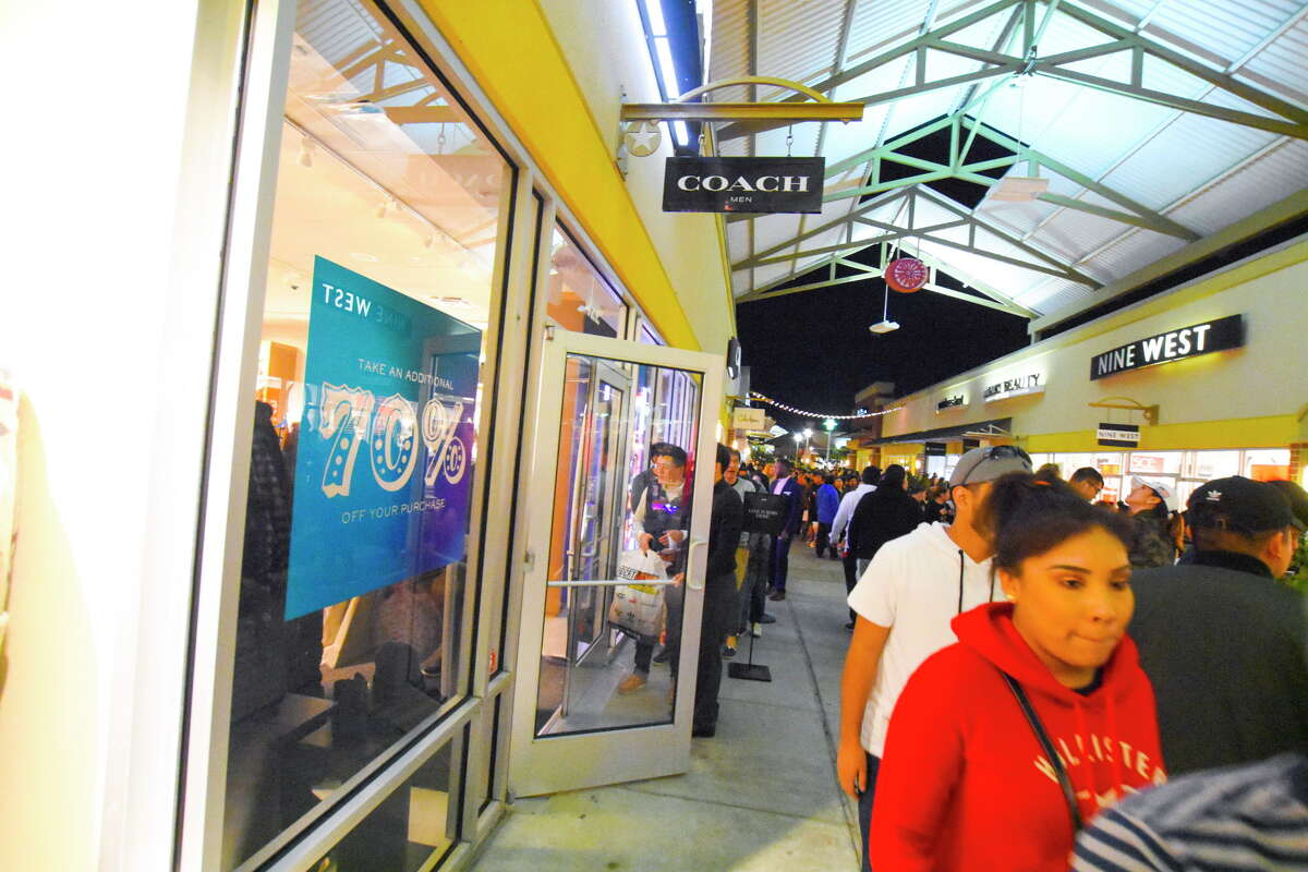 Fewer shoppers swarm stores this Black Friday morning