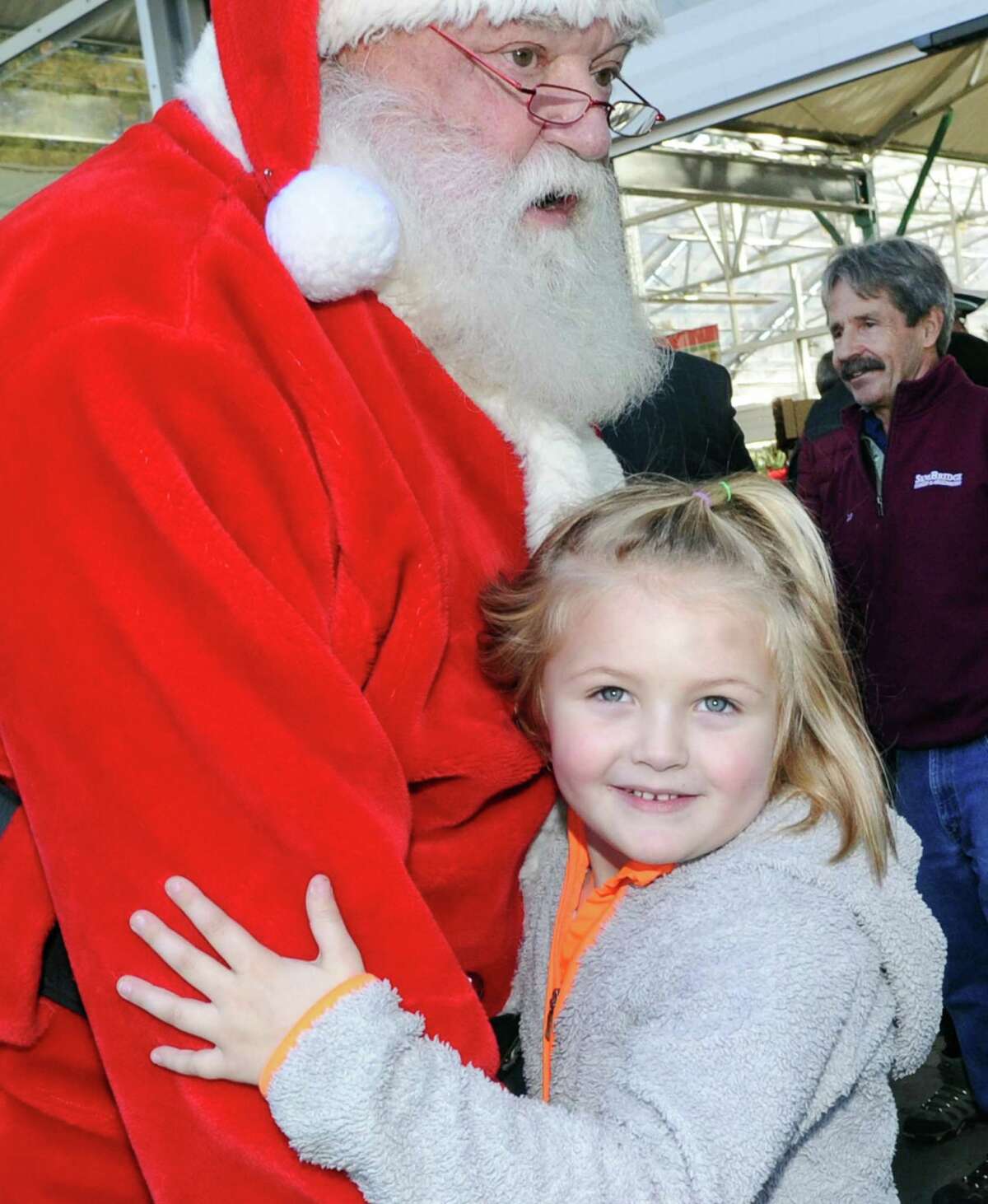 Reagan Roitsch, 5, of Greenwich, hugs Santa during the Greenwich Reindeer Festival & Santa's Village at Sam Bridge Nursery & Greenhouses in Greenwich, Conn., Friday, Nov. 24, 2017. The reindeer will be on hand through Dec. 23rd and Santa is available for photos Monday - Friday from noon to 6 p.m., Saturdays 9:00 a.m. - 6 p.m., through Dec. 23rd. Sam Bridge Nursery & Greenhouses is located at 437 North Street in Greenwich.