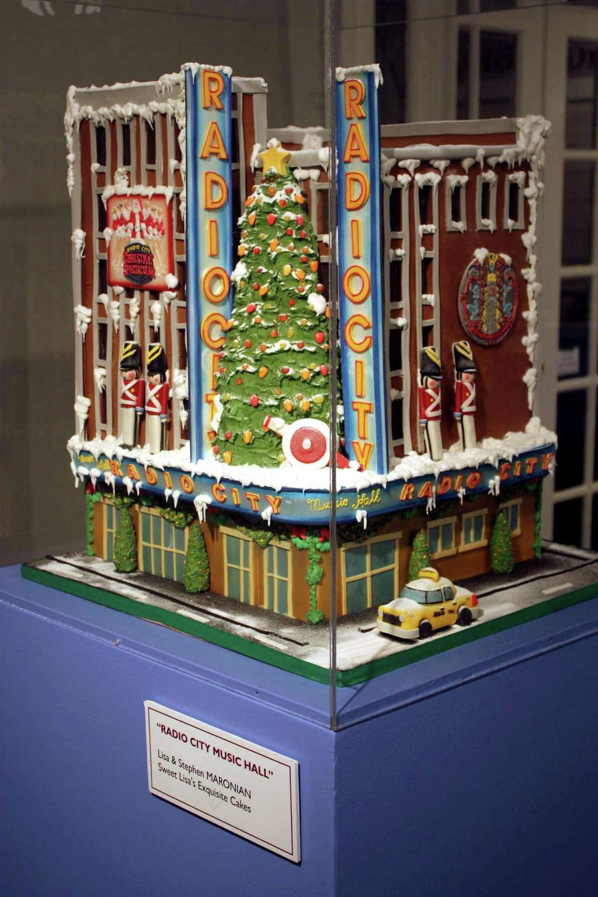 Baker Lisa Maronian, of Sweet Lisa’s in Greenwich, has developed a reputation for being up to any 3-D challenge, including this cake above in the shape of Radio City Music Hall. Left, a garden grows on a Sweet Lisa’s wedding cake.