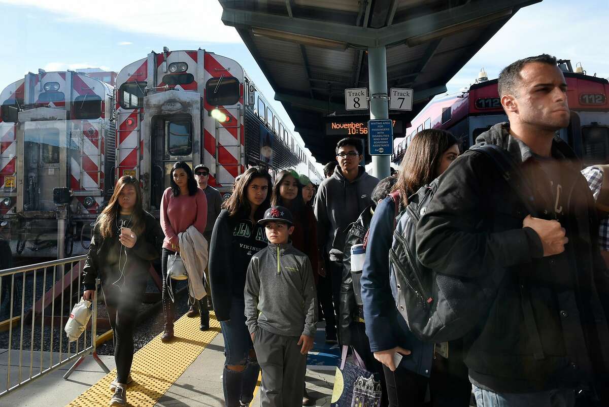 Passengers exit a train at the Caltrain yard at 4th and Townsend Streets in San Francisco, CA, on Friday November 24, 2017.