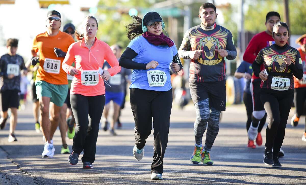Runners make their way up Santa Maria Avenue on Thursday as they participate in the 37th Annual Guajolote Run.