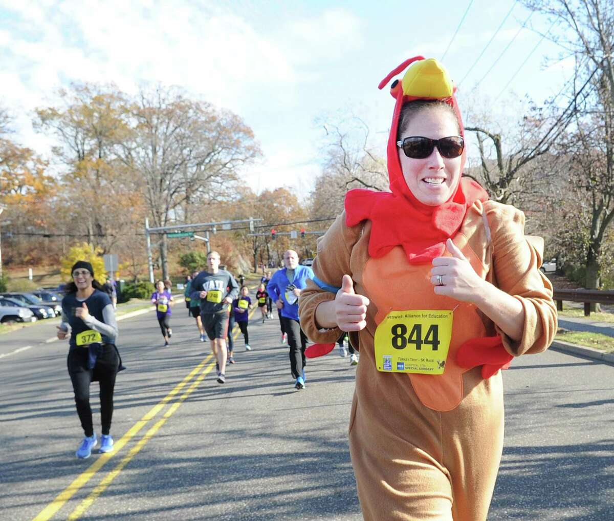 Jess Reid of Greenwich wore a turkey costume as she ran in the Greenwich Alliance for Education Turkey Trot 5K & 1 Mile Walk/Run at Roger Sherman Baldwin Park in Greenwich, Conn., Saturday morning, Nov. 25, 2017.