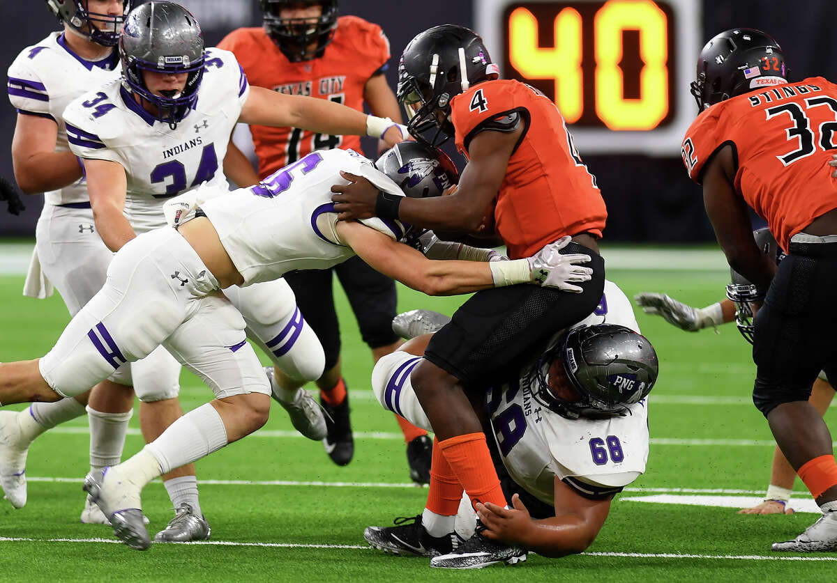 Port Neches-Groves' Preston Hughes takes down a Texas City runner during a play-off game at NRG Stadium Friday. Photo taken Friday, November 24, 2017 Guiseppe Barranco/The Enterprise