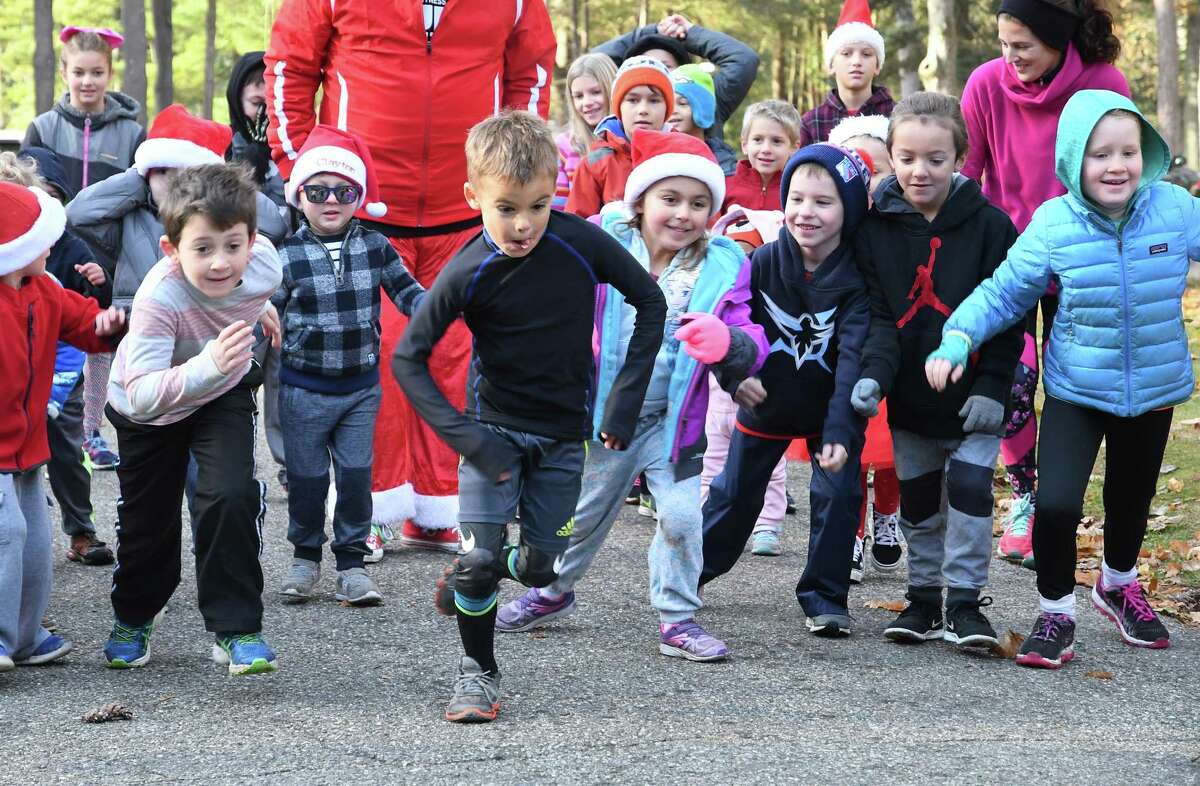 The six and under kids start their fun run at the Run Santa Run 5k Run, Walk and Kids Fun Run at Harrybrooke Park in New Milford, Saturday, Nov. 25, 2017. Funds raised this year will be donated to the park and the Juvenile Diabetes Research.
