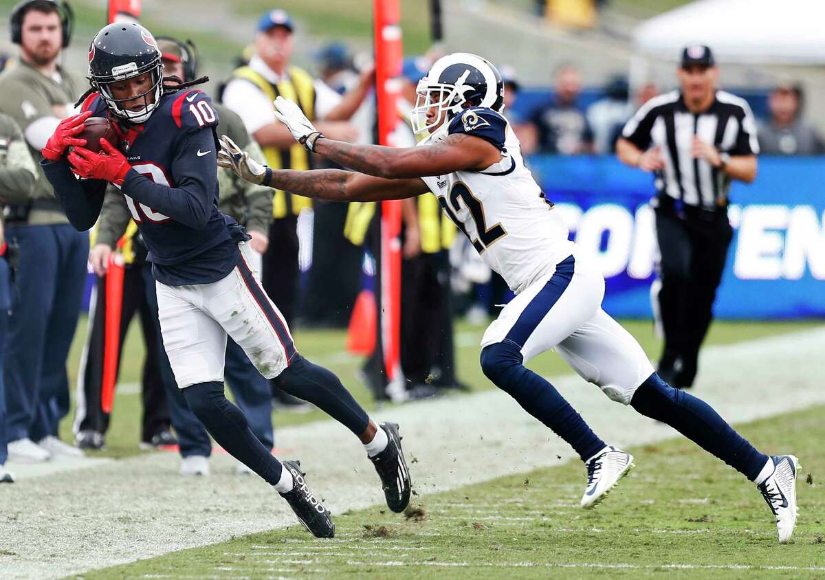 Houston Texans wide receiver DeAndre Hopkins (10) makes a first down reception against Los Angeles Rams cornerback Trumaine Johnson (22) during the third quarter of an NFL football game at the Los Angeles Memorial Coliseum on Sunday, Nov. 12, 2017, in Los Angeles, Mass. ( Brett Coomer / Houston Chronicle )