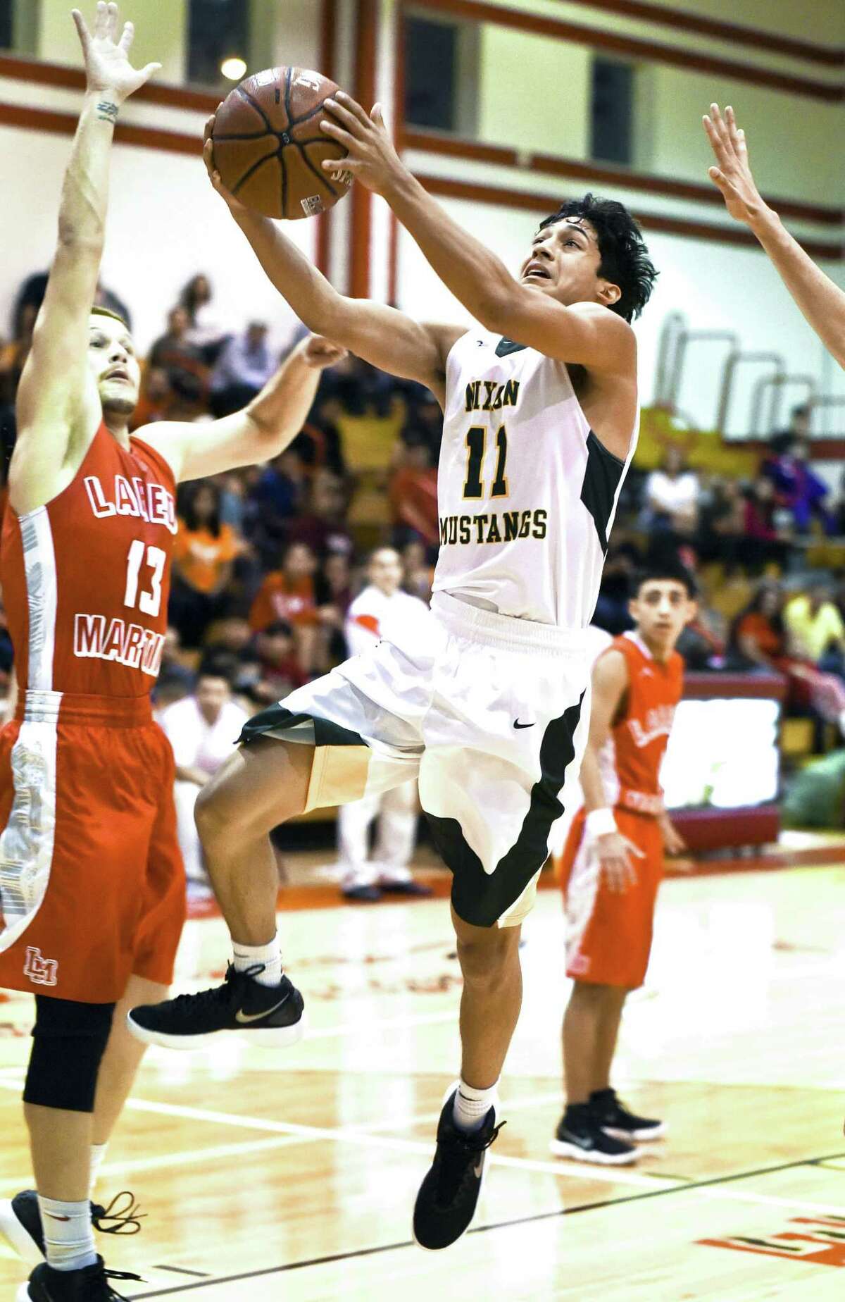 Joel Pena scored 11 points Saturday as Nixon won its first ever Border Olympics title with an 80-50 win over rival Martin.